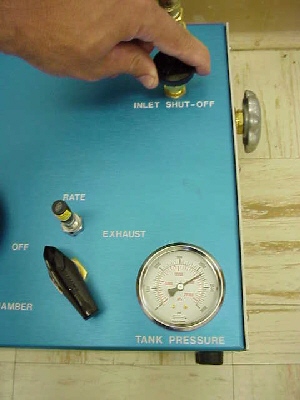 Filling the tank for the Model 610 Pressure Chamber PMS Instruments